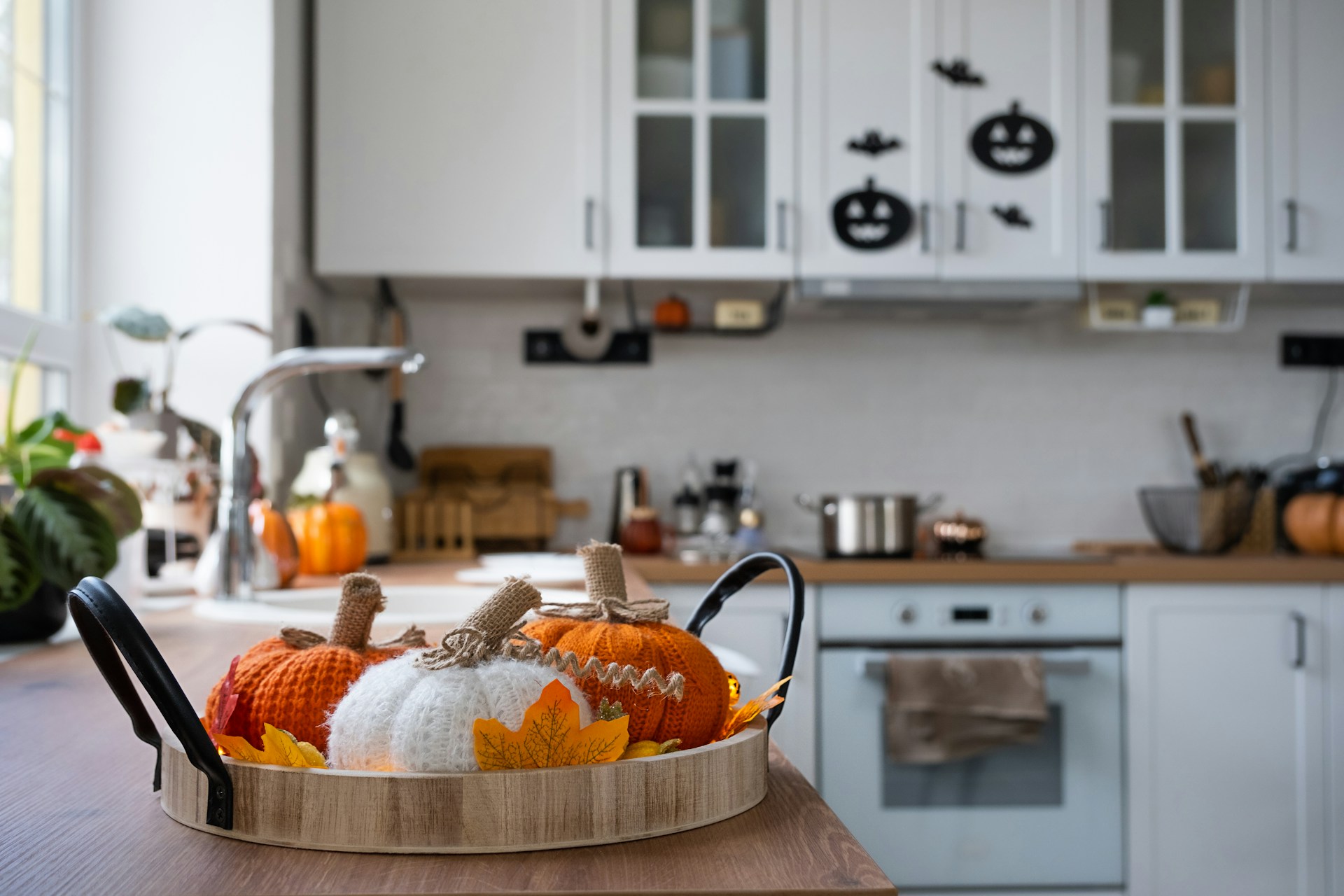 kitchen decorated for fall with faucet in the background